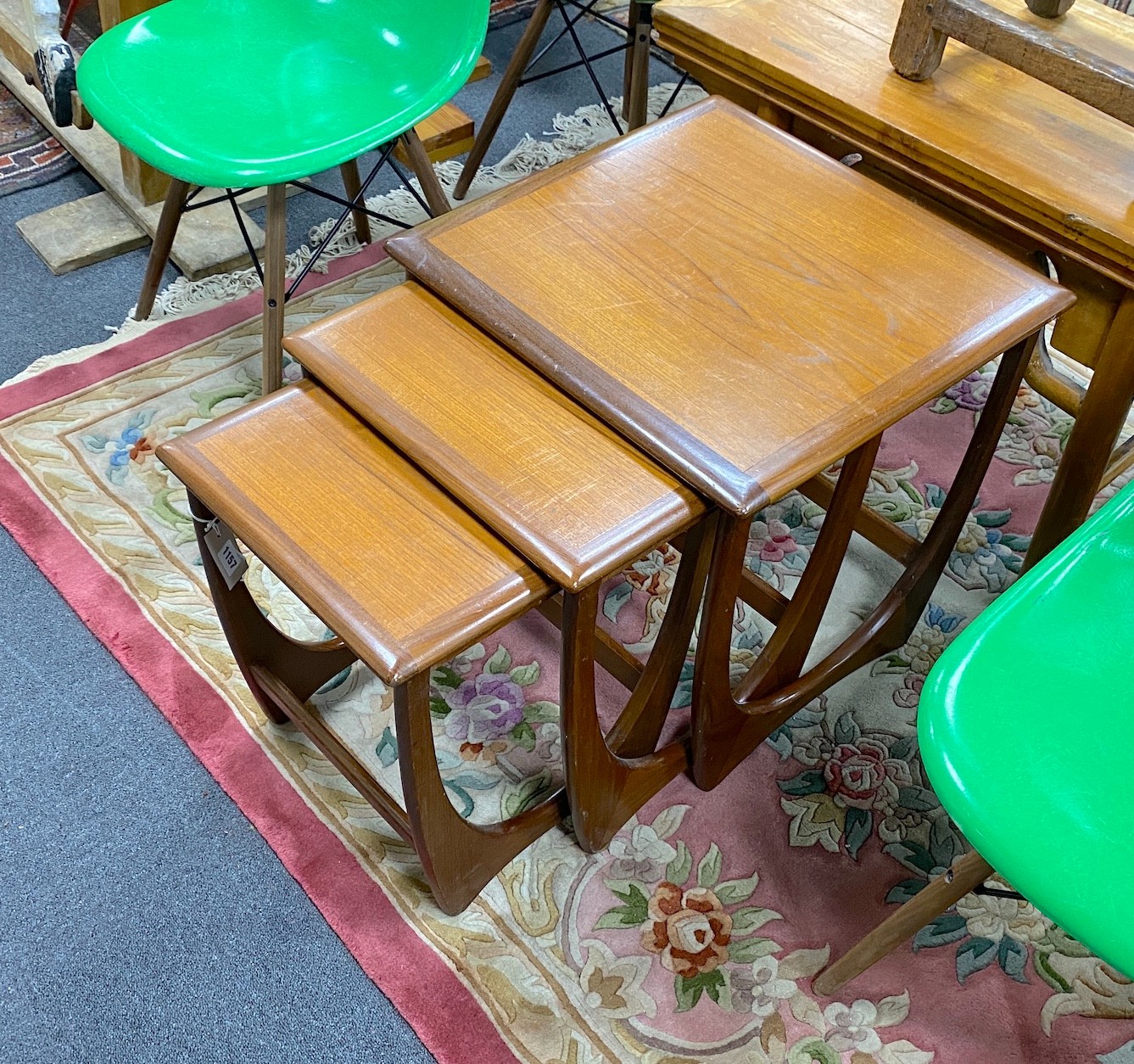 A nest of three teak G Plan tables, width 51cm, depth 49cm, height 50cm